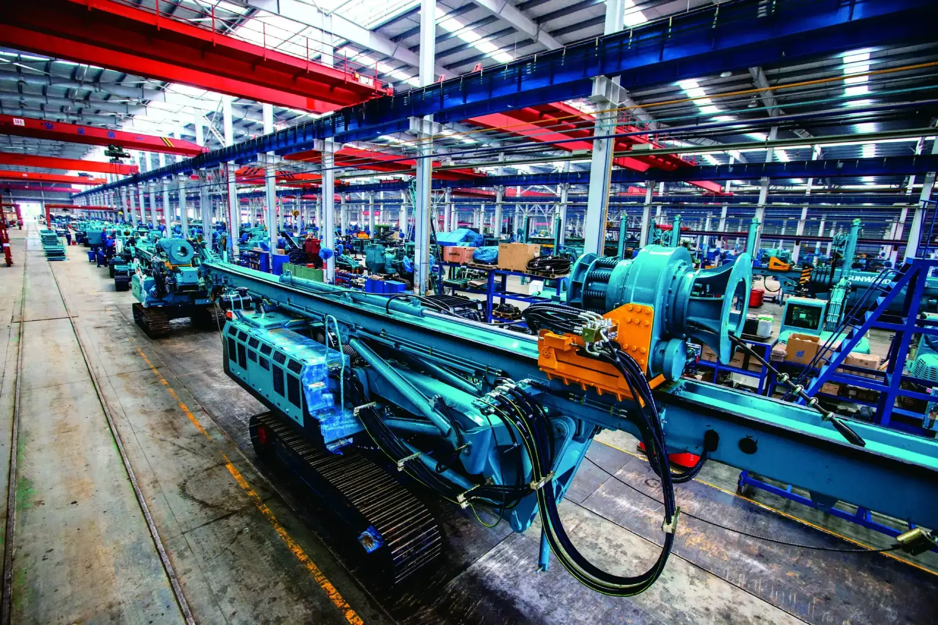 Factory floor with large industrial machinery.